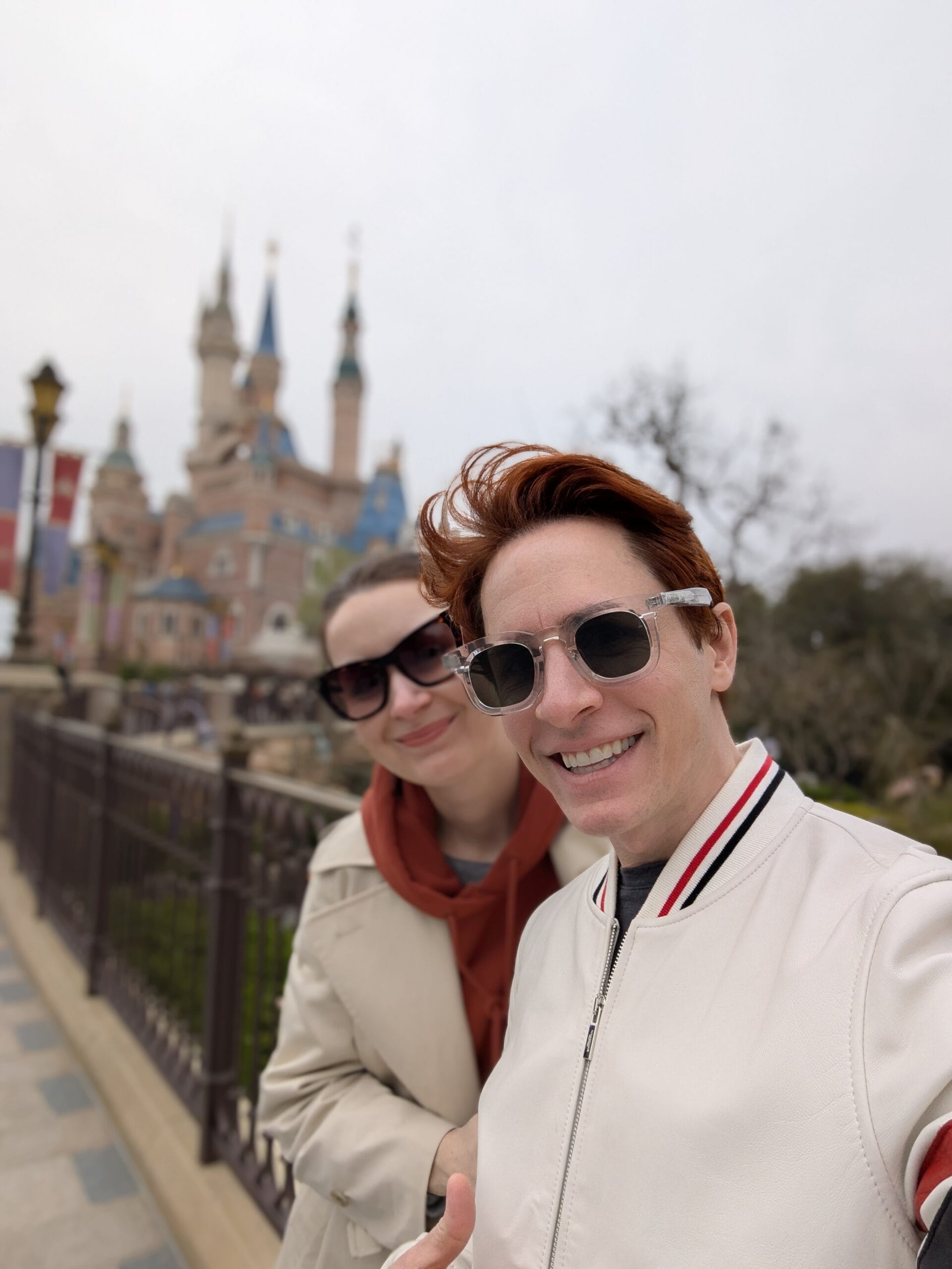 Scoot and Z take a selfie as adults visiting Disneyland Shangahi