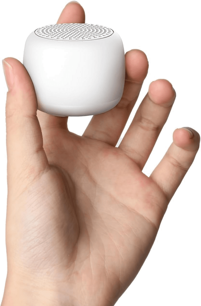 A small Babelio portable white noise machine, the best travel gear for masking hotel room noise.