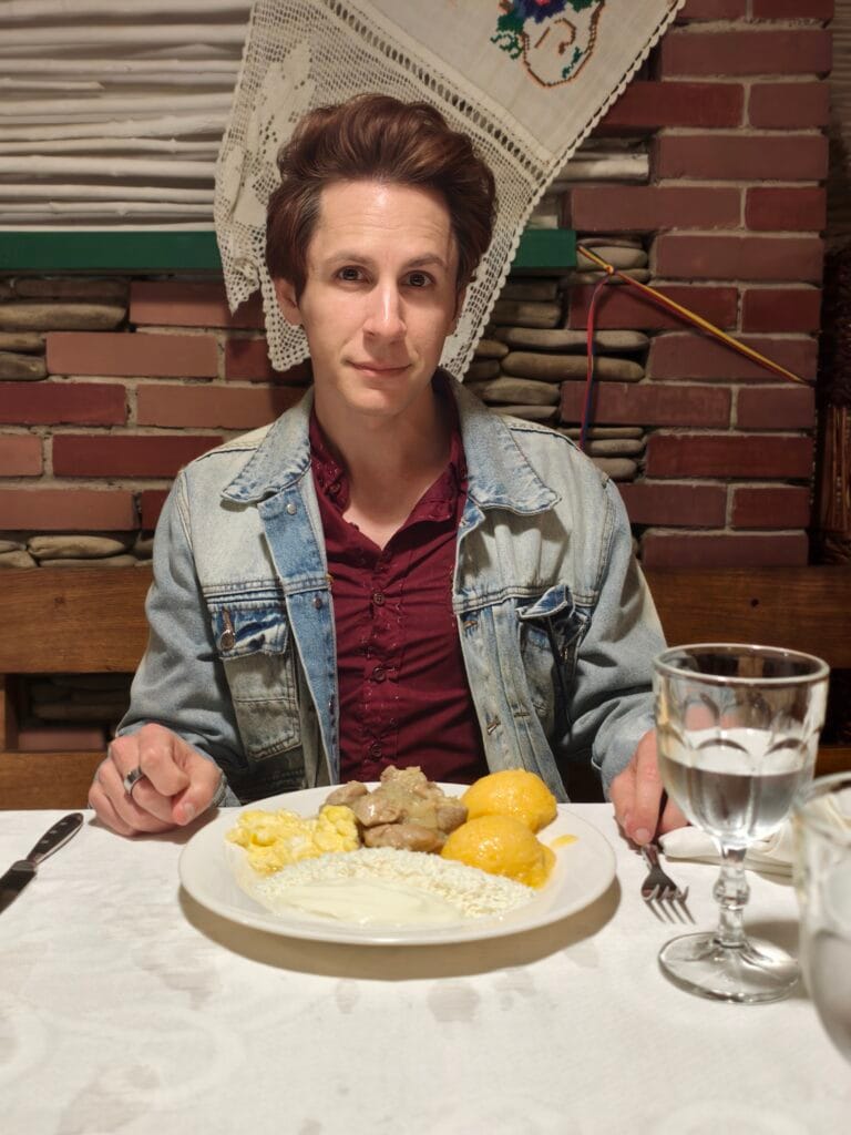 Scott enjoying traditional moldvanian food