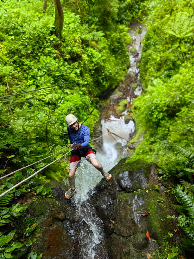 Canyoning in Costa Rica rappelling down a waterfall near La Fortuna is one of the best activities to do in Costa Rica