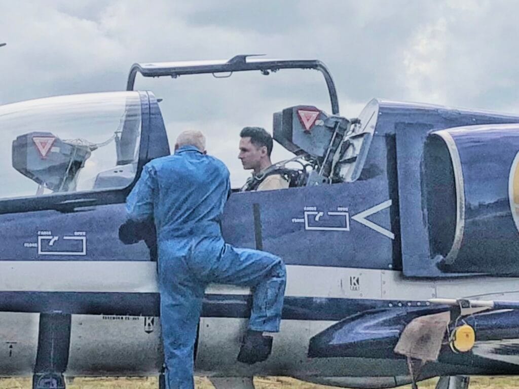 A Soviet-trained pilot giving Scoot a cockpit briefing before his jet fighter flight experience.