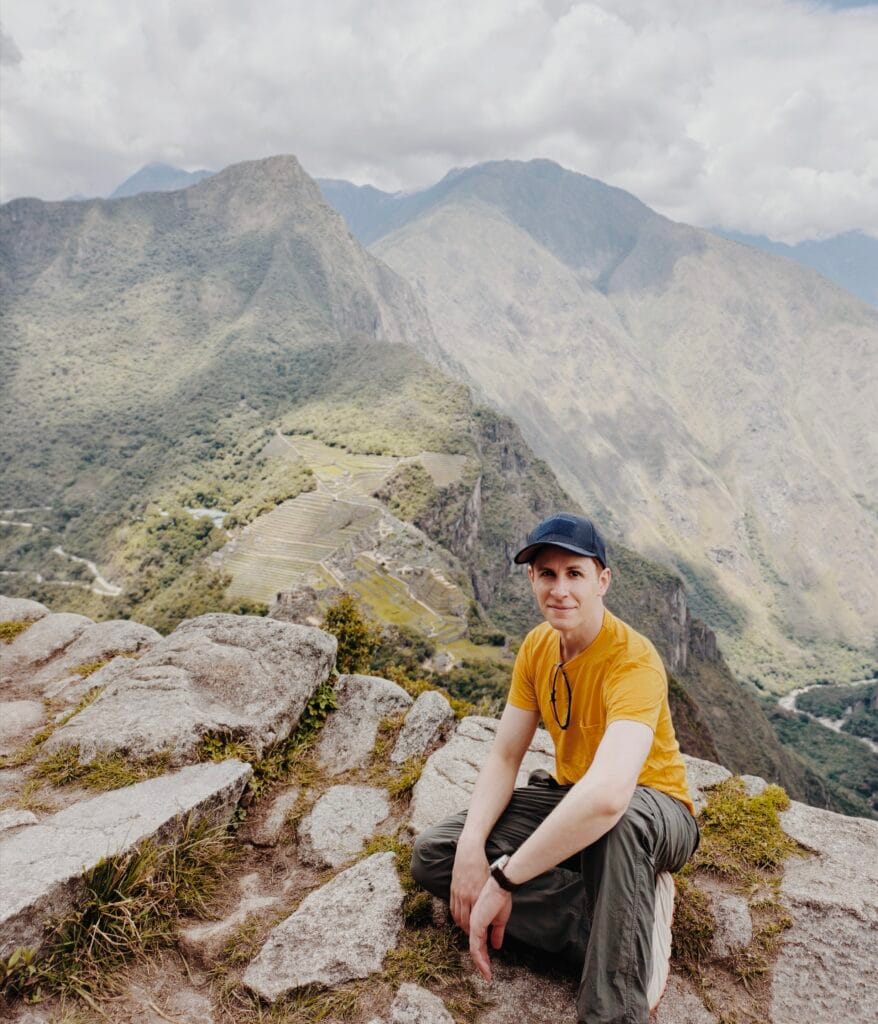 Steep stone trail ascending toward Huayna Picchu mountain behind the Machu Picchu citadel