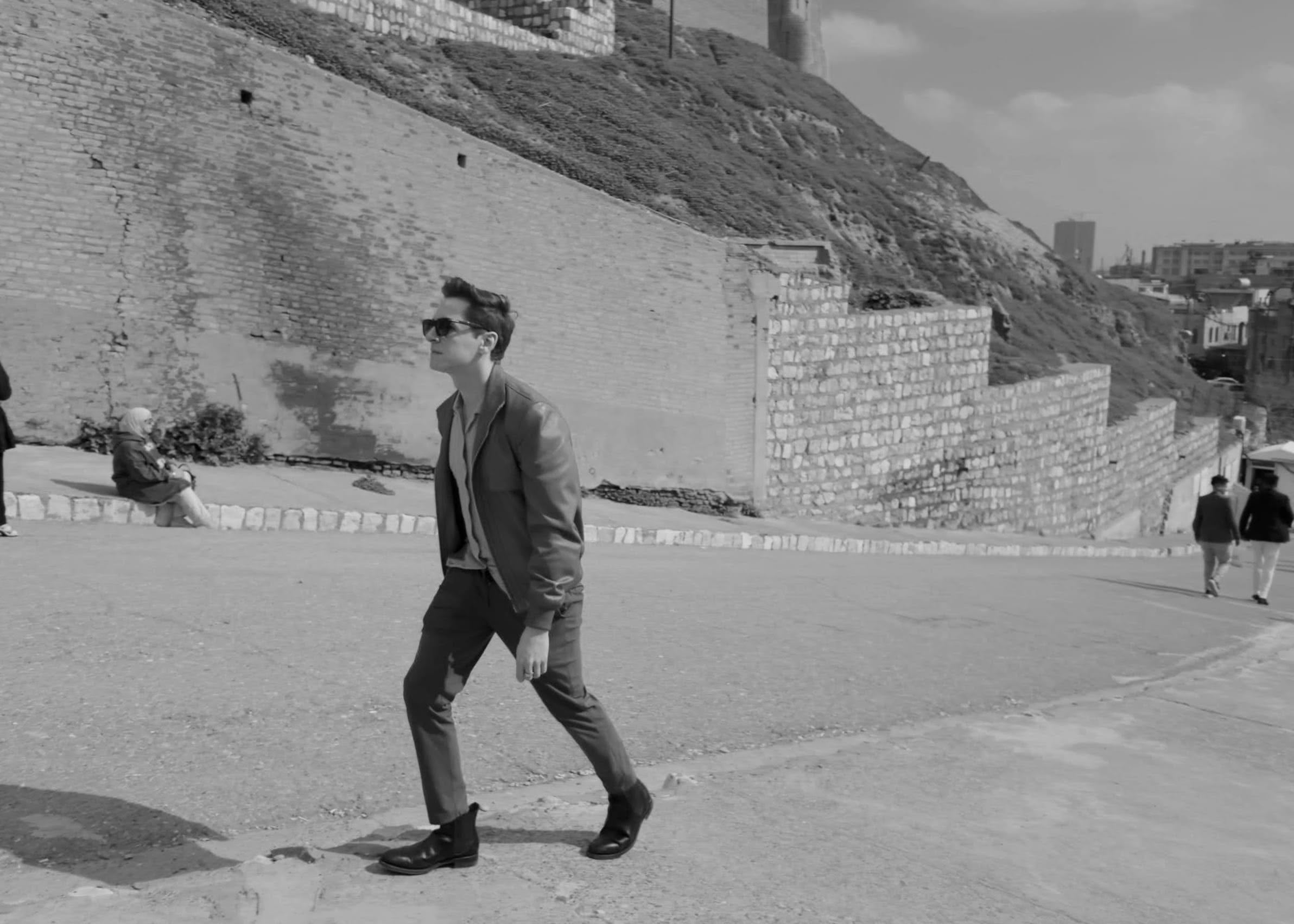 Scoot walking toward the ancient Erbil Citadael travelling in Iraq Kurdistan