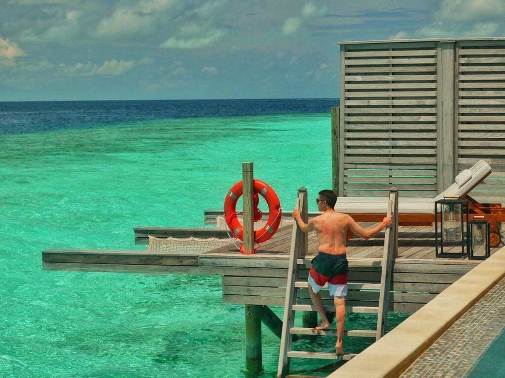 Scoot climbing stairs to private infinity pool in the Maldives.