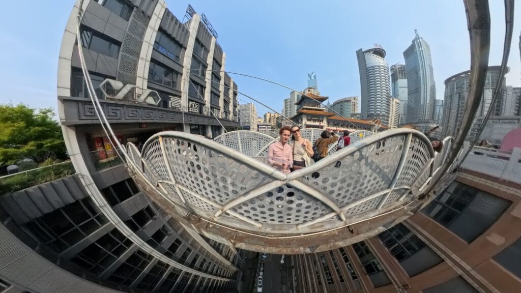 Scoot and Z on the famous bridge in Chongqing, China, the 8D city