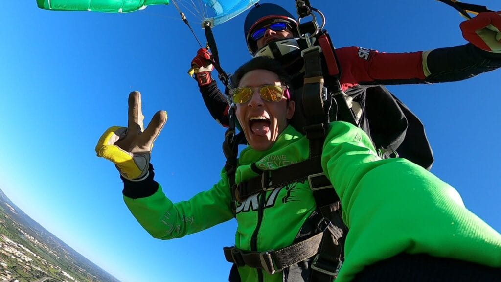Parachute descent whilst skydiving Algarve coastline after 15000ft skydive