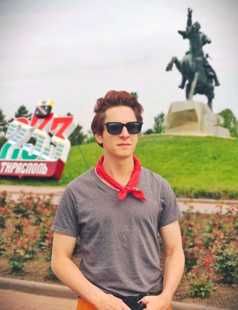 Scoot standing at Suvorov Monument visiting transnistria.
